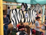 Children play on playground equipment at the Democratic School of Hadera